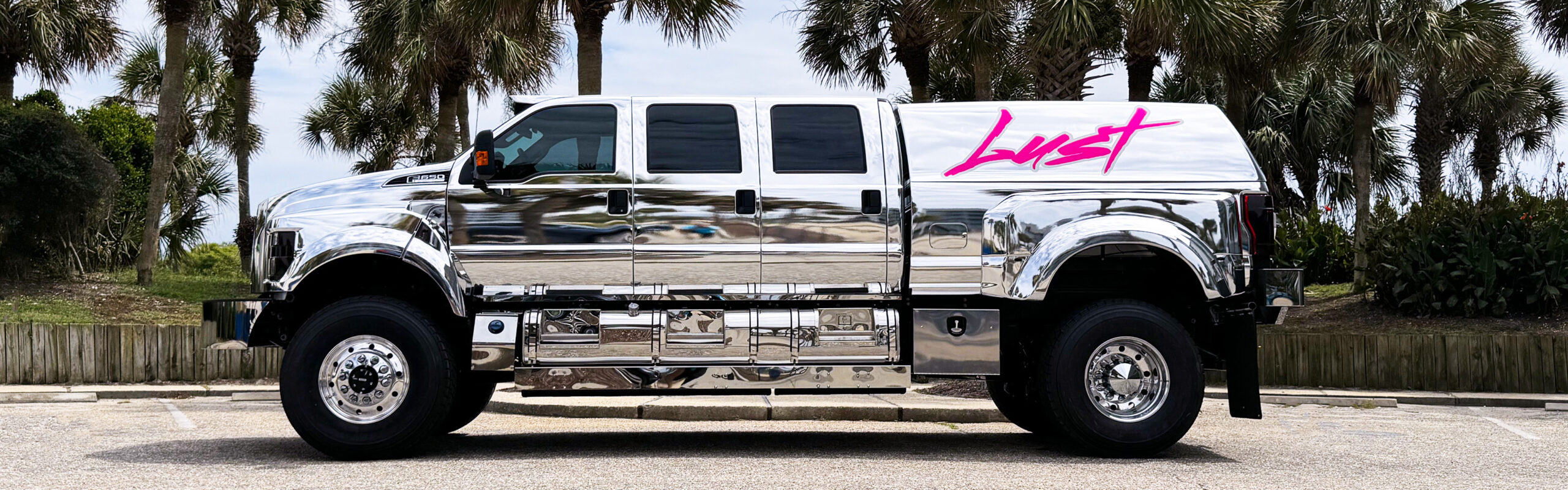 Chrome transportation truck with Lust branding